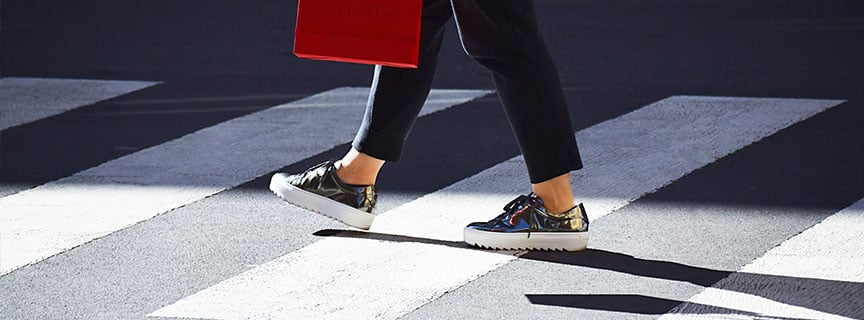 photo of woman walkin on the street